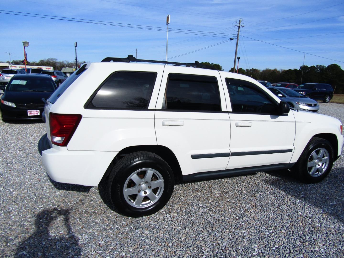 2009 WHITE Jeep Grand Cherokee (1J8GS48KX9C) , Automatic transmission, located at 15016 S Hwy 231, Midland City, AL, 36350, (334) 983-3001, 31.306210, -85.495277 - Photo#7